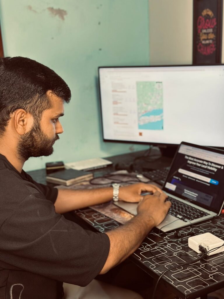 AI SEO vs AEO, and the Noise Nobody Needed 1 israr khurshid local seo expert working on his desk